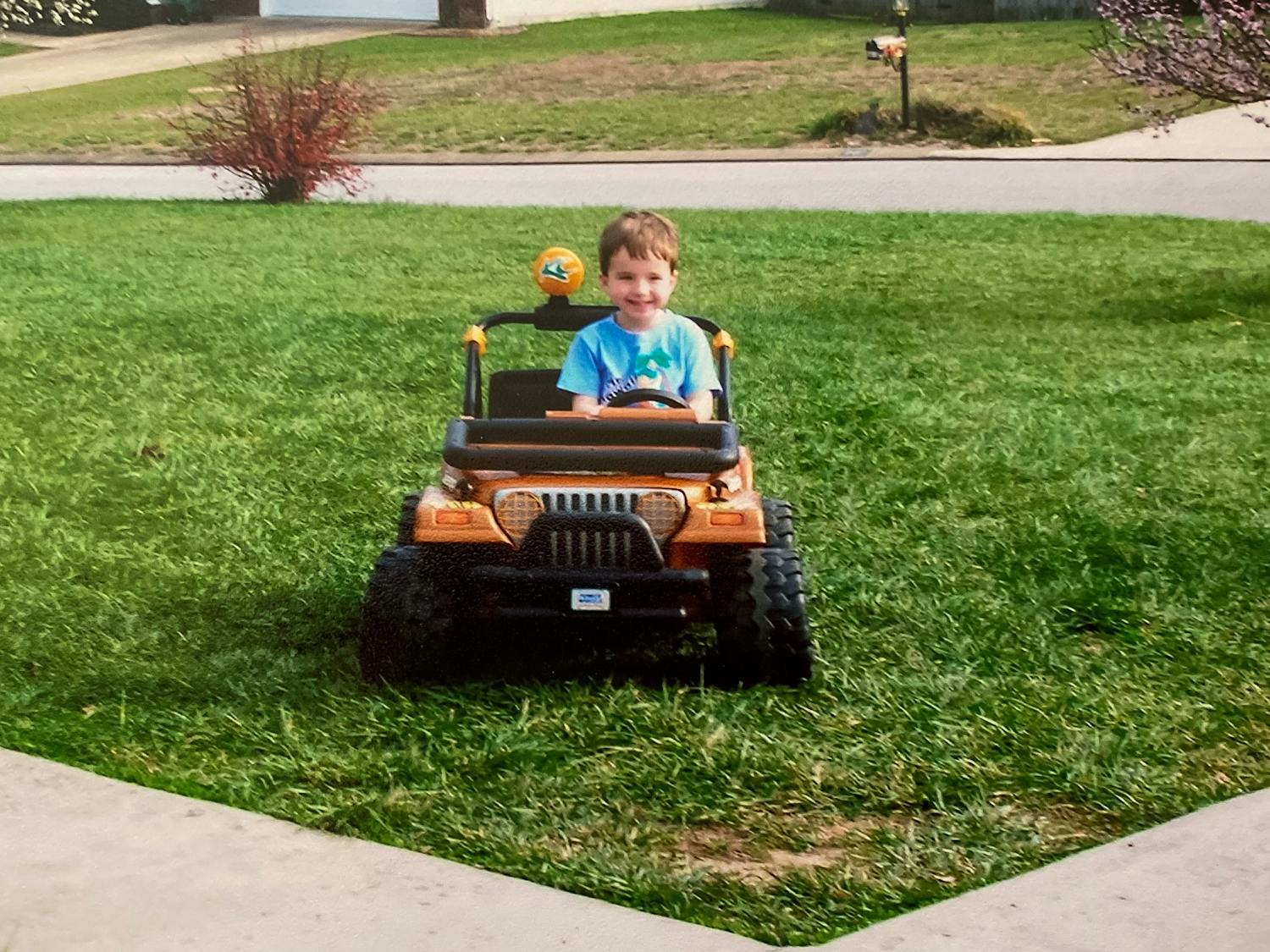 A young Preston Fore happily drives his toy Jeep through his yard.
Photo Courtesy of the Fore Family.