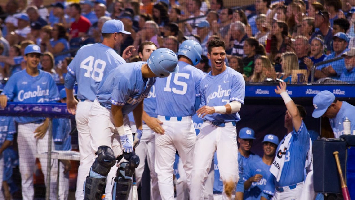 Carolina baseball players congratulate one another during the game on May 23. 