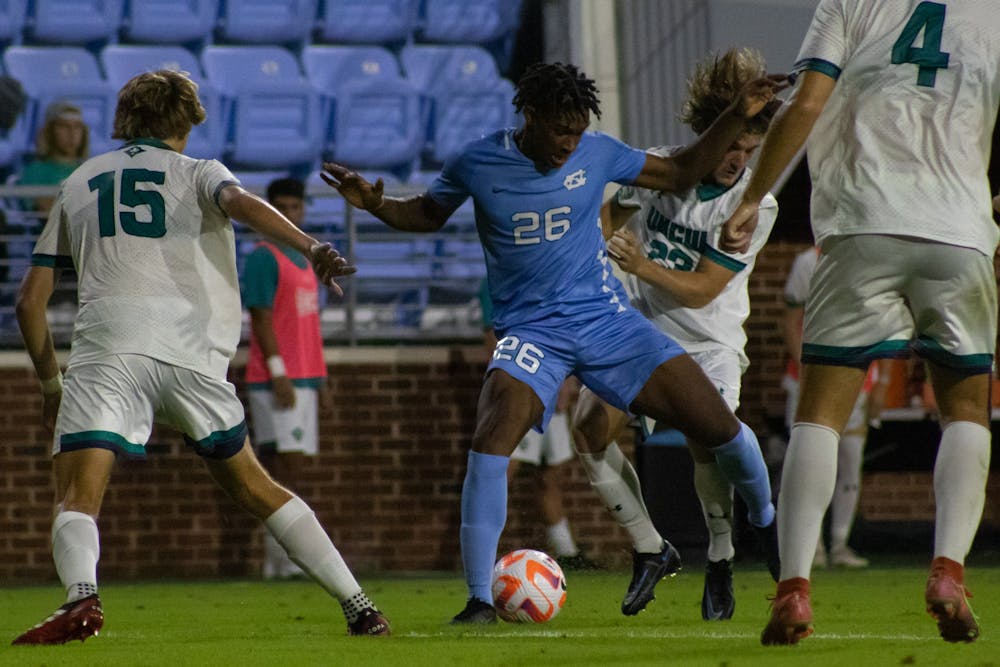 UNC sophomore defender Matt Edwards (26) protects the ball during the Tar Heels' 0-0 tie against UNCW at Dorrance Field on Tuesday, Sept. 20, 2022.