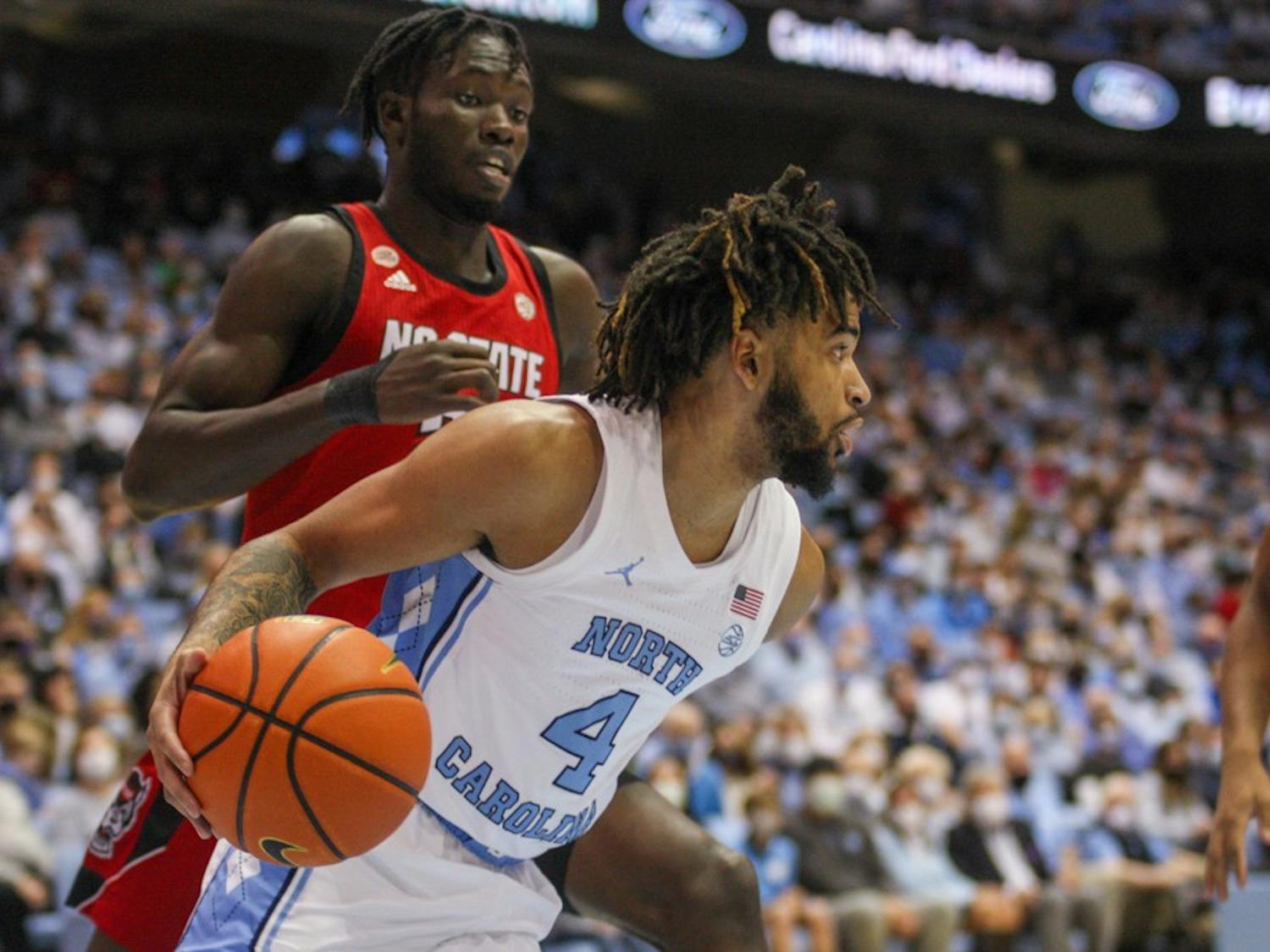 UNC sophomore guard RJ Davis (4) runs with the ball at the game against North Carolina State University on Saturday Jan. 29, 2022 at the Smith Center in Chapel Hill. UNC won 100-80.