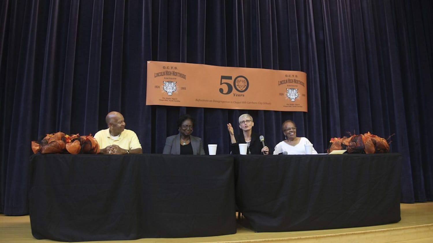 From left: Stanley Vickers, Carolyn Daniels, Judy Van Wyk, and Alice Page Battle speak about their experiences when the Chapel Hills schools were racially integrated. 