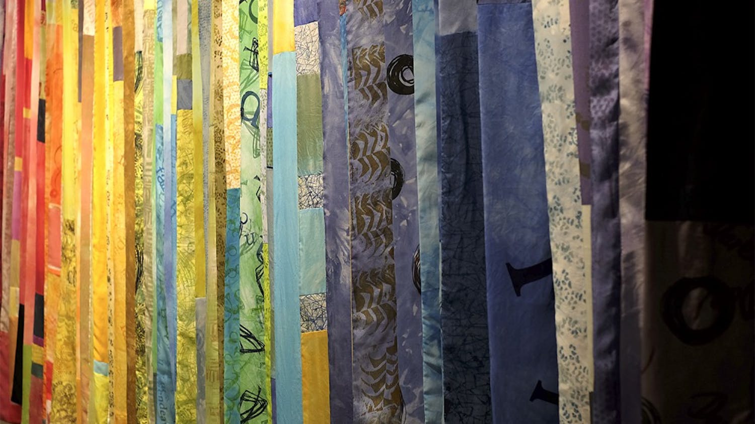 A collection of scarves hang at the Frank Gallery on West Franklin Street from March 10th to the 22nd. The lead artists are textile artist Peg Gignoux and poet Grey Brown. All 200 will be presented to cancer patients in the area.  