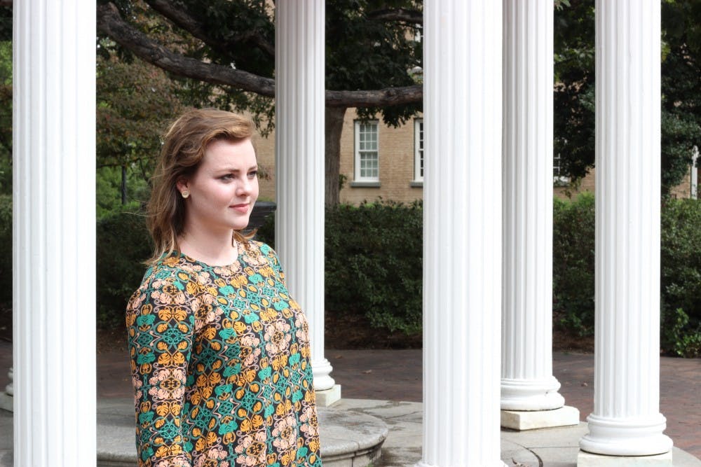 <p>UNC junior Mallory Hoffman poses for a portrait at the Old Well on Tuesday Sept. 26.</p>
