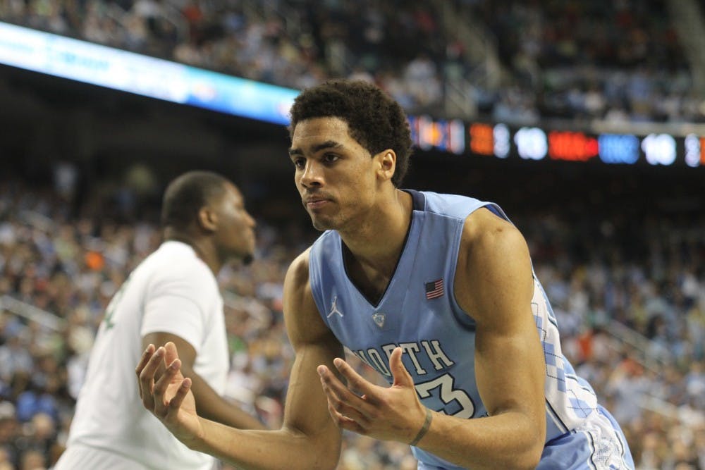 	<p>James Michael McAdoo reacts after poking the ball out of bounds.</p>