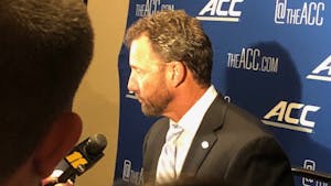 Larry Fedora conducting a press conference at the 2018 ACC Kickoff in Charlotte.