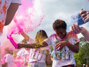 UNC students participate in &nbsp;Holi Moli, an annual event held by students to celebrate Holi, on Saturday, April 23, 2022.