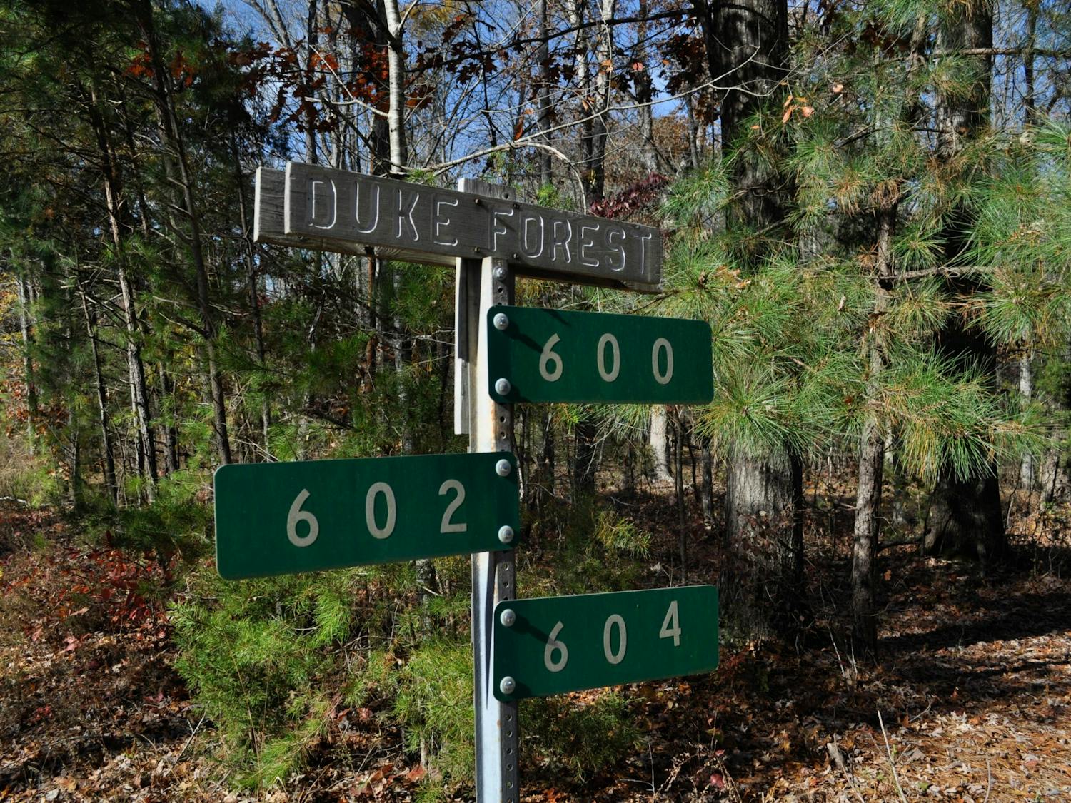 A sign marks the beginning of Duke Forest located along Eubanks Road on Sunday, Nov. 24, 2019. Plans of developing land near the corner of Eubanks Road and Old NC 86 raised concerns from residents about how Duke Forest's research and natural sites would be affected.
