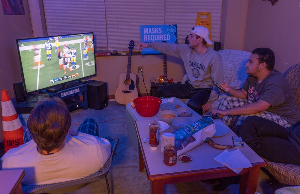 UNC sophomores Dylan Georges, JM D'Ambrosio, and Javon Davis watch the Super Bowl on Sunday, Feb. 13, 2022.