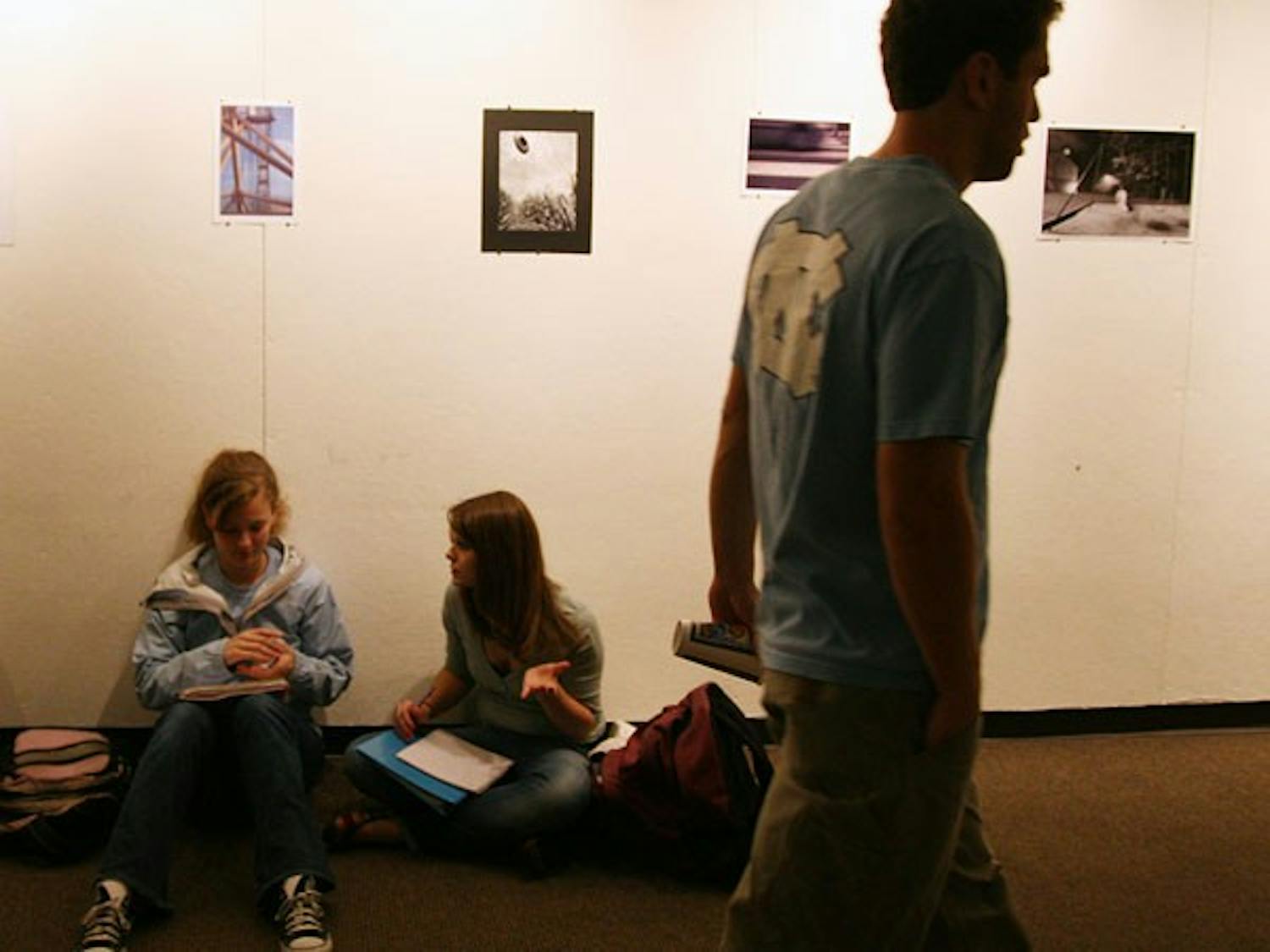 Students study Sunday night under the current art exhibit in the Student Union gallery. DTH/Jessey Dearing