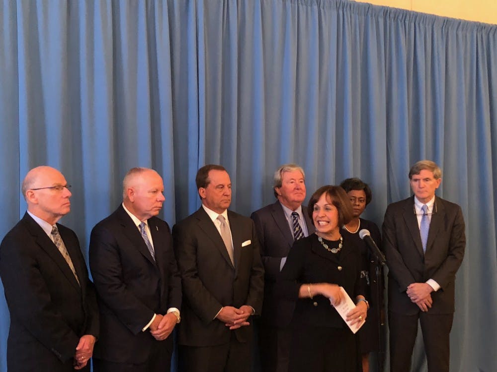 <p>Chancellor Carol Folt and university officials speak to members of the press following the UNC Board of Trustee’s Dec. 3 meeting, where the board announced its proposal for the future of Silent Sam, at Carolina Inn.</p>