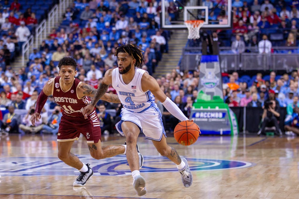 UNC junior guard RJ Davis (4) dribbles the ball during game against Boston College in the second round of the 2023 New York Life ACC Men's Basketball Tournament tournament on Wednesday, March 8, 2023, at Greensboro Coliseum.