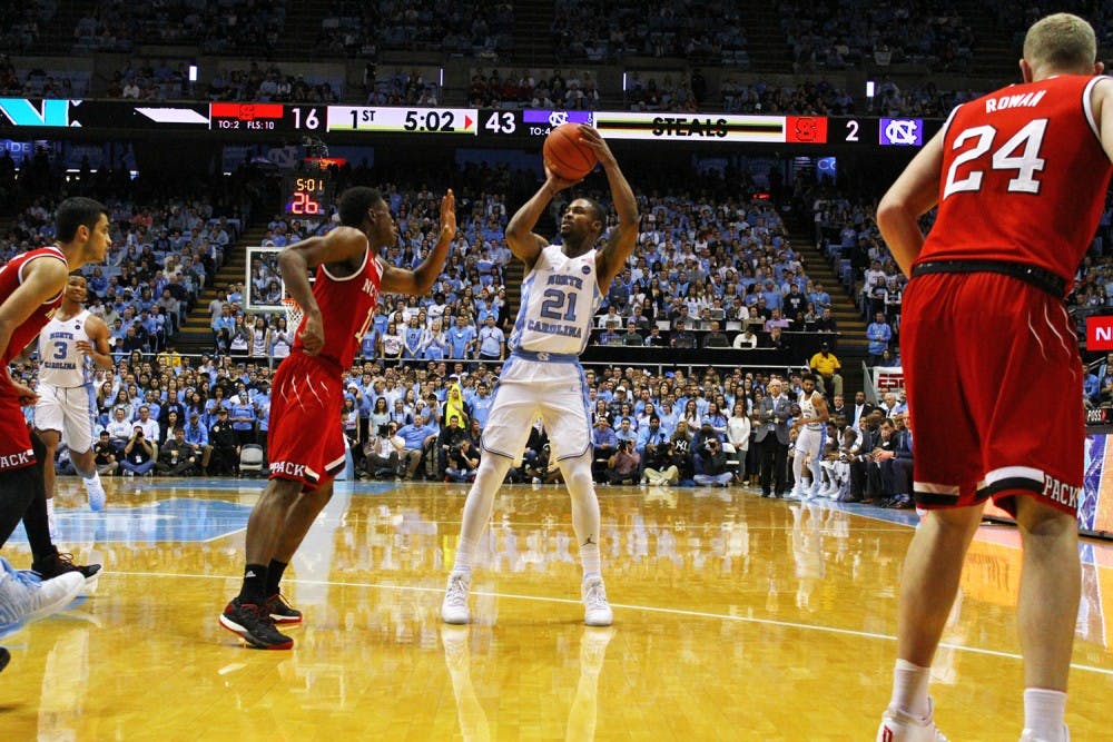 North Carolina guard Seventh Woods (21) attempts a shot against N.C. State on Jan. 8. He has cut down on his turnovers during ACC play.