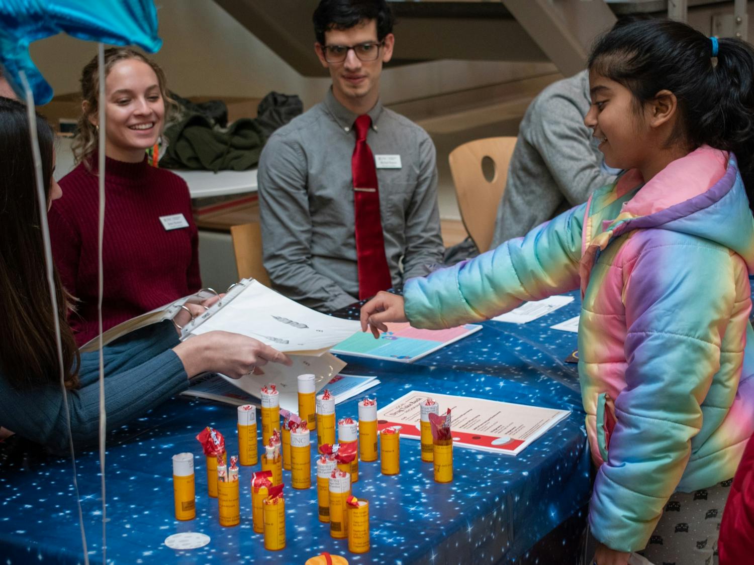 An attendee participates in an activity at the Health Fair during the UNC Adams School of Dentistry's tenth annual Give Kids A Smile Day on Friday, Feb. 3, 2023.