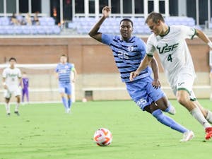 UNC junior forward Akeim Clarke (25) chases after the ball during a 1-0 home victory over South Florida at Dorrance Field on Aug. 28, 2022.