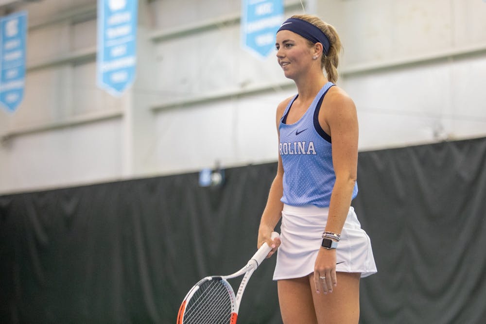 UNC senior Makenna Jones smiles following a successful volley during her singles match against the University of Michigan at the Cone-Kenfield Tennis Center in Chapel Hill, N.C., on Feb. 1, 2020.  The Tar Heels went on to secure a 4-0 victory against Michigan.