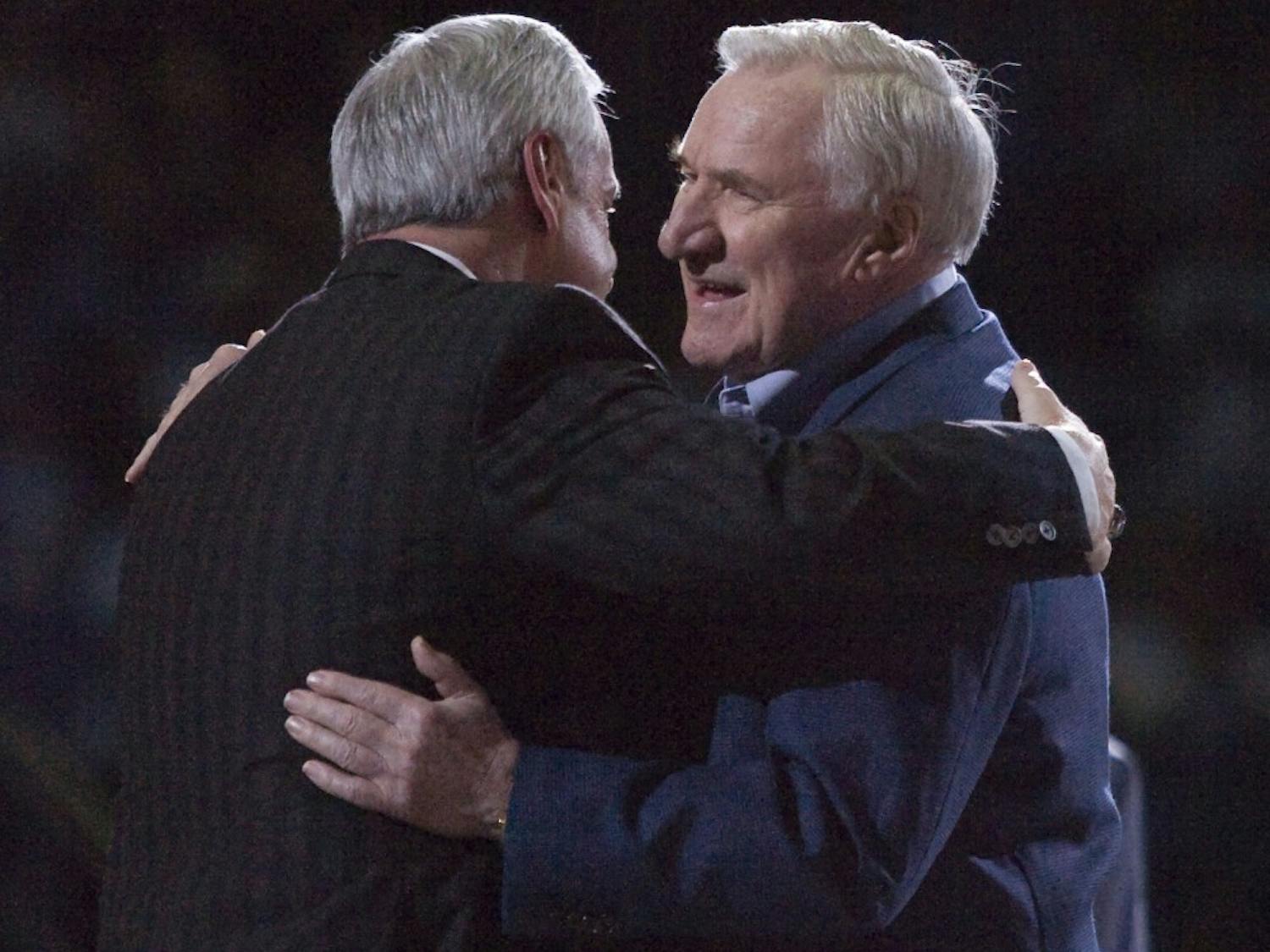 University of North Carolina coach Roy Williams, left, embraces former coach Dean Smith during the Celebration of a Century at the Smith Center in Chapel Hill, North Carolina, Friday, February 12, 2010. This is the 100th year of Carolina basketball. (Robert Willett/Raleigh News &amp; Observer/MCT)
