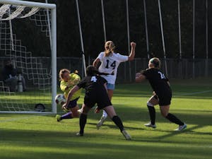 Sophomore Morgan Goff (14) scores the third and final goal in Saturday's game against High Point at WakeMed Soccer Park in Cary.