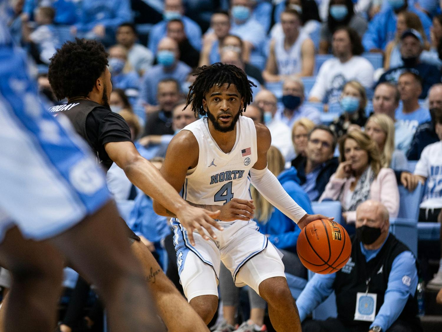 Sophomore guard RJ Davis (4) searches for a pass during a game against Brown at the Smith Center on Nov. 12. The Tar Heels defeated Brown 94-87, earning their second win of the season.
