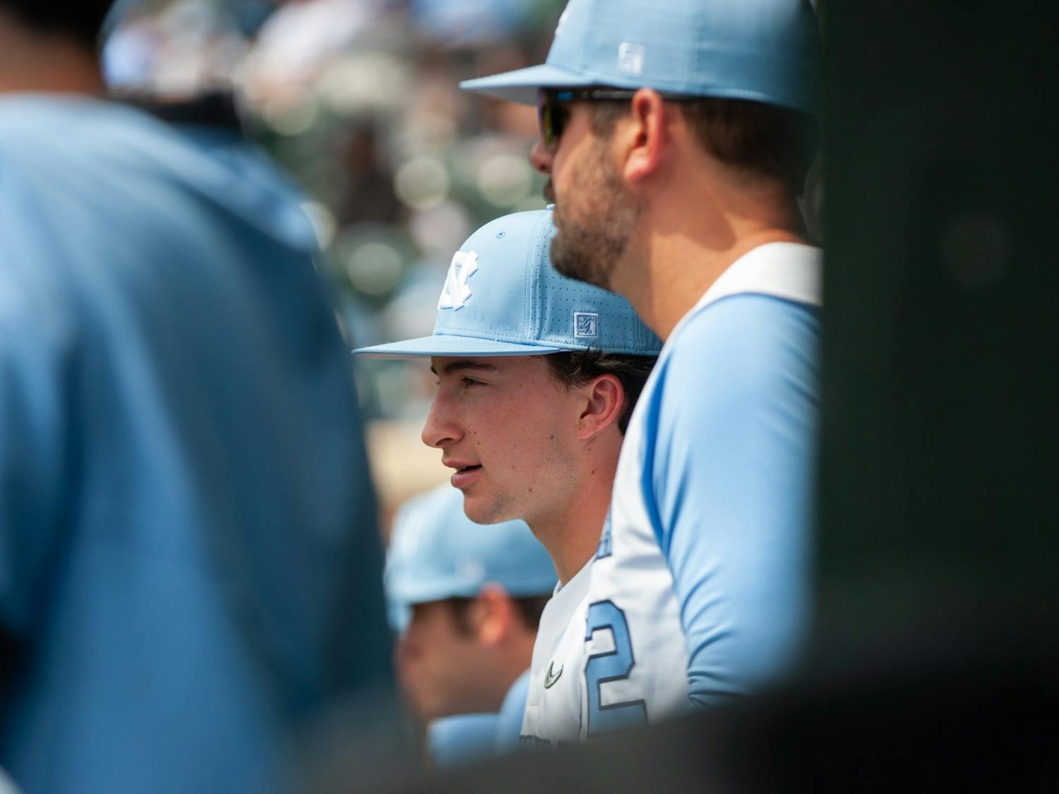 UNC freshman infielder and right-handed pitcher Justin Szestowicki (14) watching his team play from the sideline during a baseball game against Georgia Tech on Saturday, April 16, 2022, at Boshamer Stadium. UNC won 10-5.