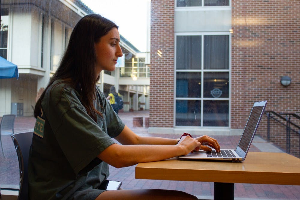 Kendall Harrow, a sophomore economics major, works on an assignment on her computer at the UNC Student Store on Wednesday, Oct. 9th, 2019. 