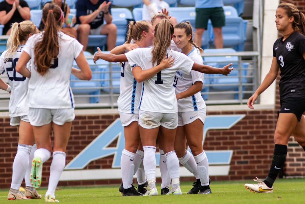 <p>The UNC Women’s soccer team celebrates after a goal against the University of Central Florida on Sunday, Sept. 11, 2022, at Dorrance Field. UNC won 2-1.</p>