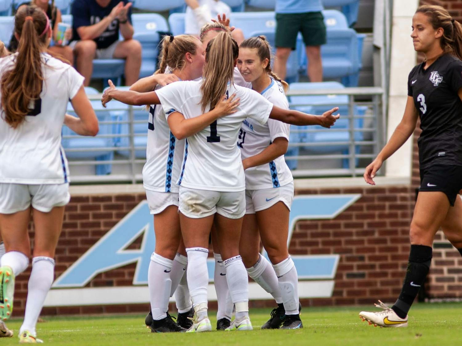 The UNC Women’s soccer team celebrates after a goal against the University of Central Florida on Sunday, Sept. 11, 2022, at Dorrance Field. UNC won 2-1.