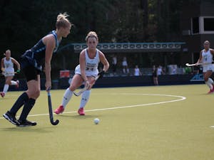 Forward Catherine Hayden Payne (8) prepares to hit the ball on Sunday Sept. 15, 2019. UNC's field hockey team won 8-0 against William and Mary.