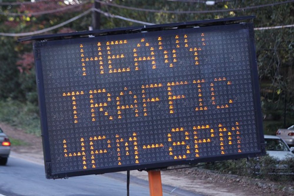 A sign warns drivers of heavy traffic expected Thursday before the game. DTH/Margaret Cheatham Williams