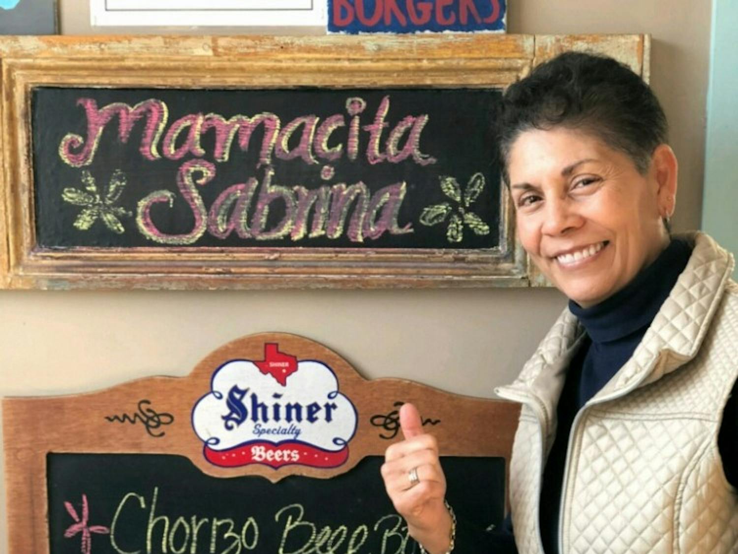 Photo courtesy of Sabrina Garcia. This photo shows Garcia at Al's Burger Shack, after the restaurant named a burger after she announced her retirement.&nbsp;