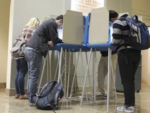 Students vote during the 2012 election at the Center for Dramatic Arts. Students must register today to vote in the primaries.