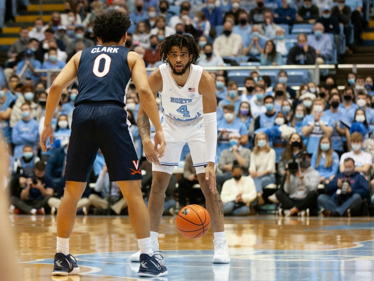 Sophomore guard RJ Davis (4) stares at his opponent at the game against Virginia at the Smith Center in Chapel Hill on Jan. 8, 2022. UNC won 74-58.