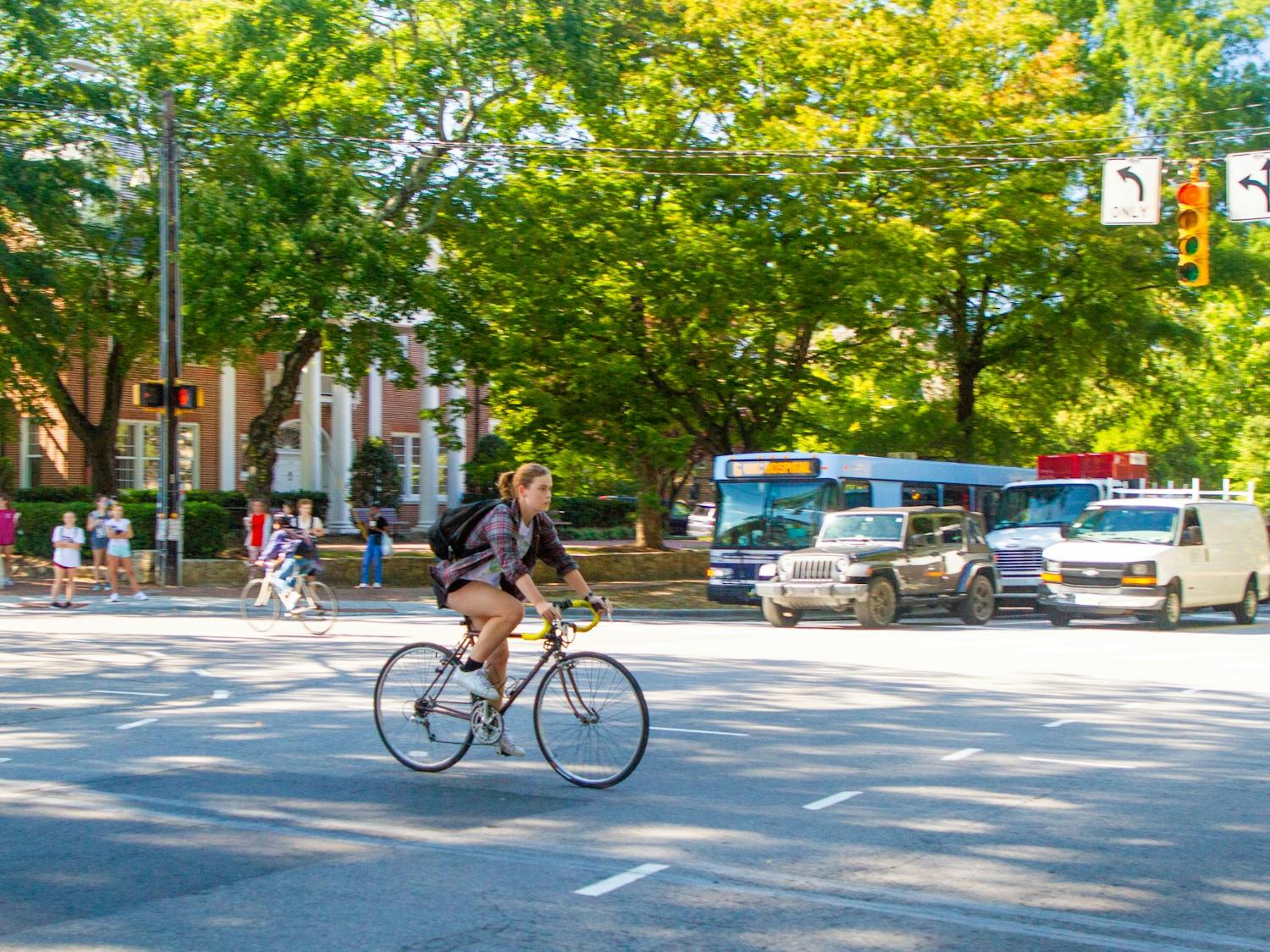 A cyclist heads toward the UNC-CH campus at the intersection of Cameron Ave. and S. Columbia St. on the afternoon of Sept. 27, 2021.