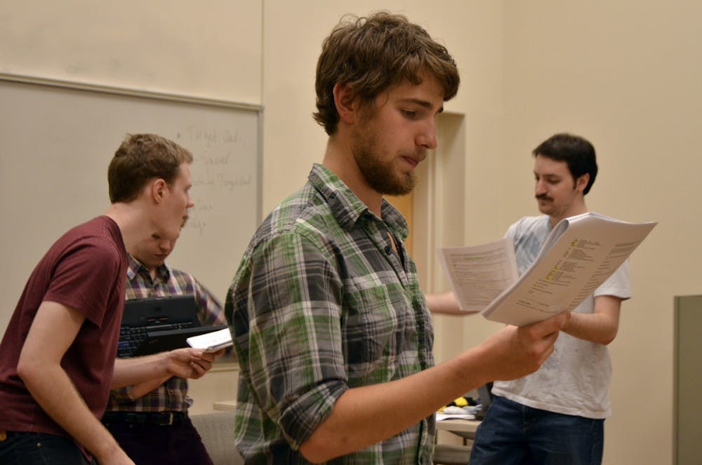 Brandon Rafalson, Anthony Kilburn and Ethan Carleton, actors of "Arr! Eh?", rehearse a song for the upcoming performance on Sunday. As the performance is a staged reading, "it is mostly to give everyone a sense of the songs and dialogue," said Cameron Yow, the director of the student written work.