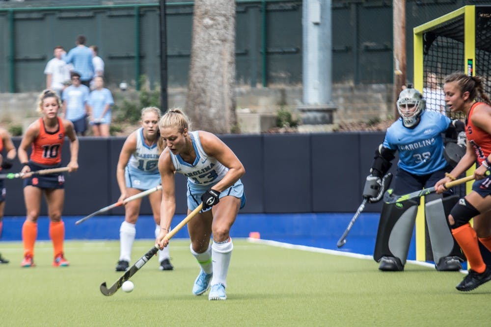 <p>Senior Back Ashley Hoffman (13) of the UNC Field Hockey team defends the ball against Syracuse in a 5-1 win on Saturday, Sept. 29, 2018, at Karen Shelton Stadium in Chapel Hill, NC.</p>