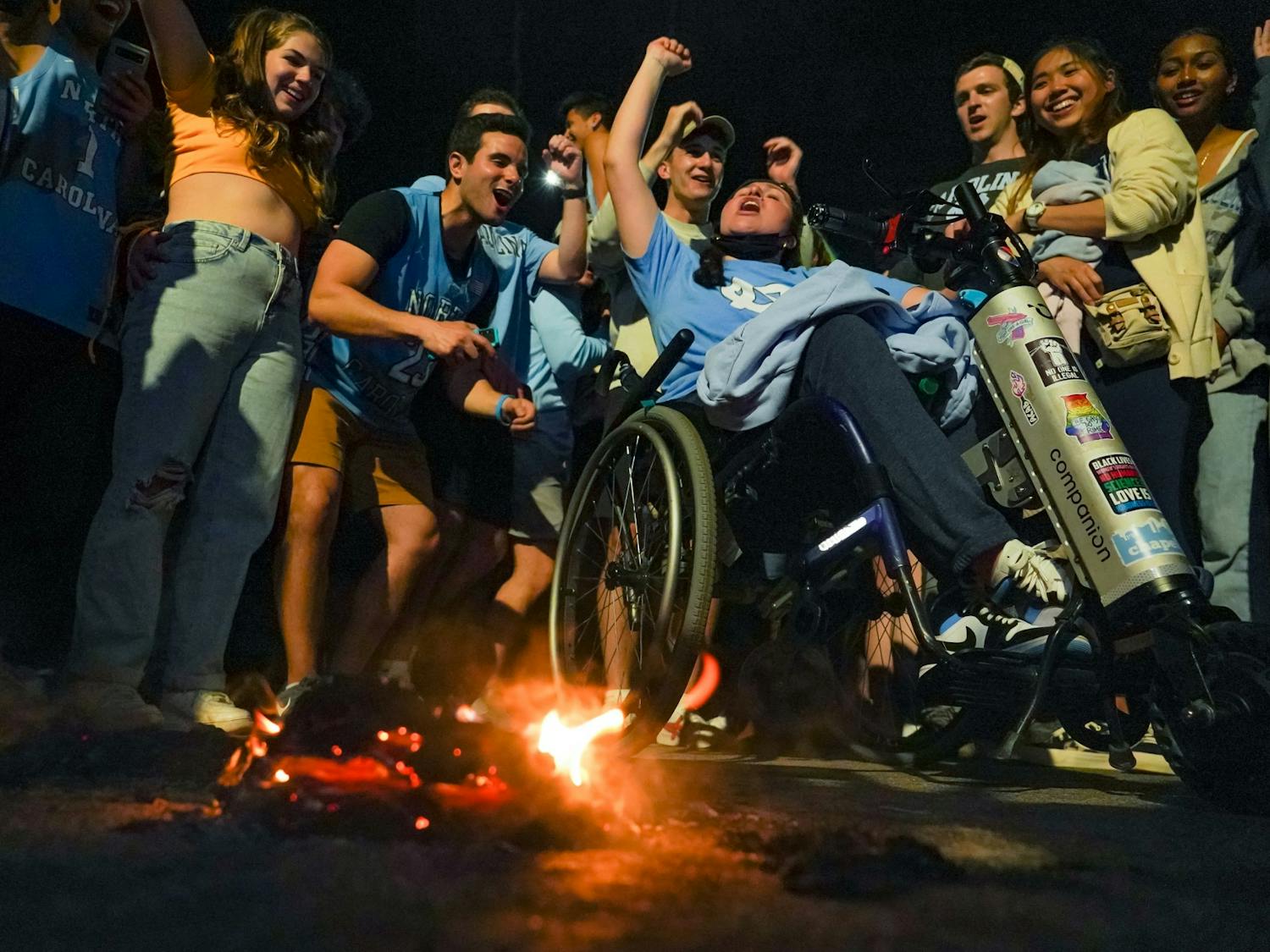 UNC fans celebrate their team's defeat of Duke on Franklin Street during the 2022 Final Four matchup on April 3, 2022. UNC beat Duke 81-77. Photo courtesy of Morgan Pirozzi 