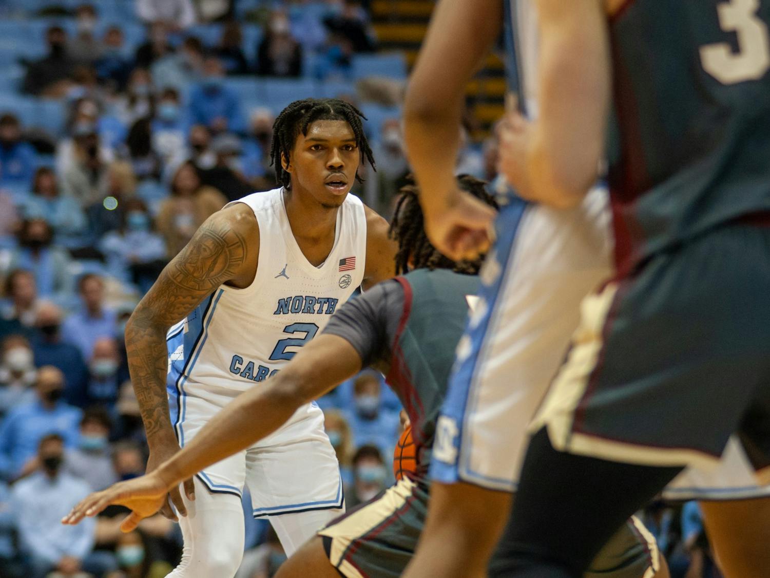 UNC sophomore guard Caleb Love (2) defends his opponent steadily during the men's basketball game against Boston College on Wednesday, Jan. 26, 2022, at the Dean Smith Center. UNC beat Boston College 58-47.
