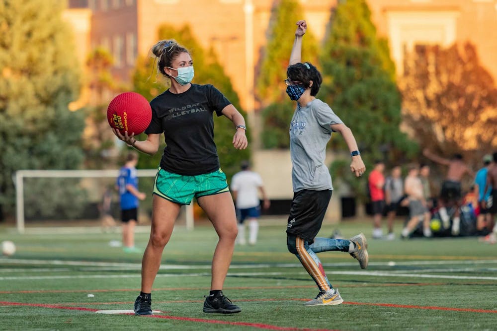 Two players compete for the ball at a kickball game as a part of UNC’s Unified Sports kickball league. Photo courtesy of Johnny Andrews. 