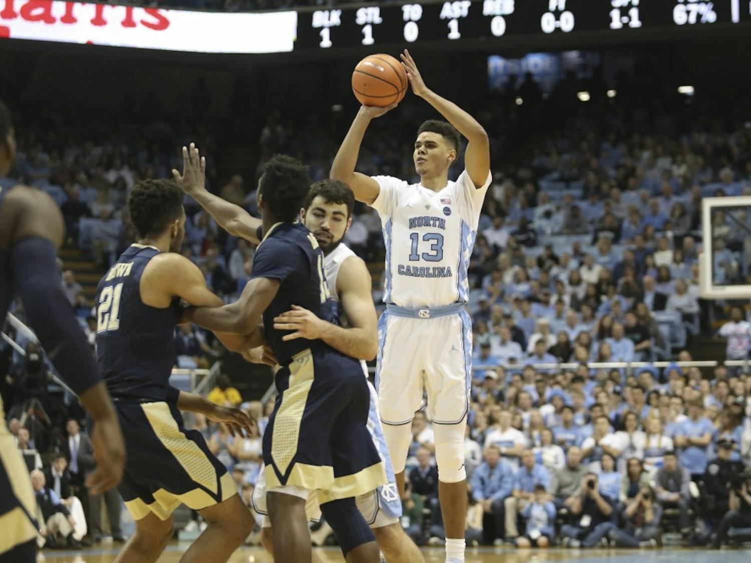 Guard Cameron Johnson (13) shoots a 3-pointer against Pittsburgh on Feb. 3 in the Smith Center.
