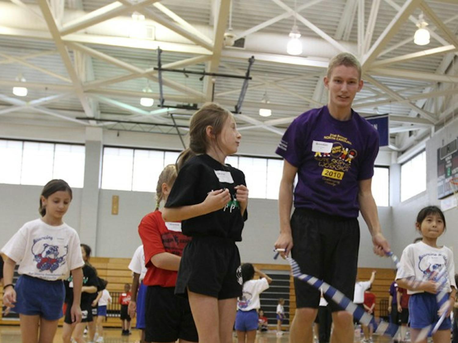 Brandon Kelly of the Bouncing Bulldogs jump ropes with kids during the 21st Annual N.C Rope Skipping Workshop on Saturday.