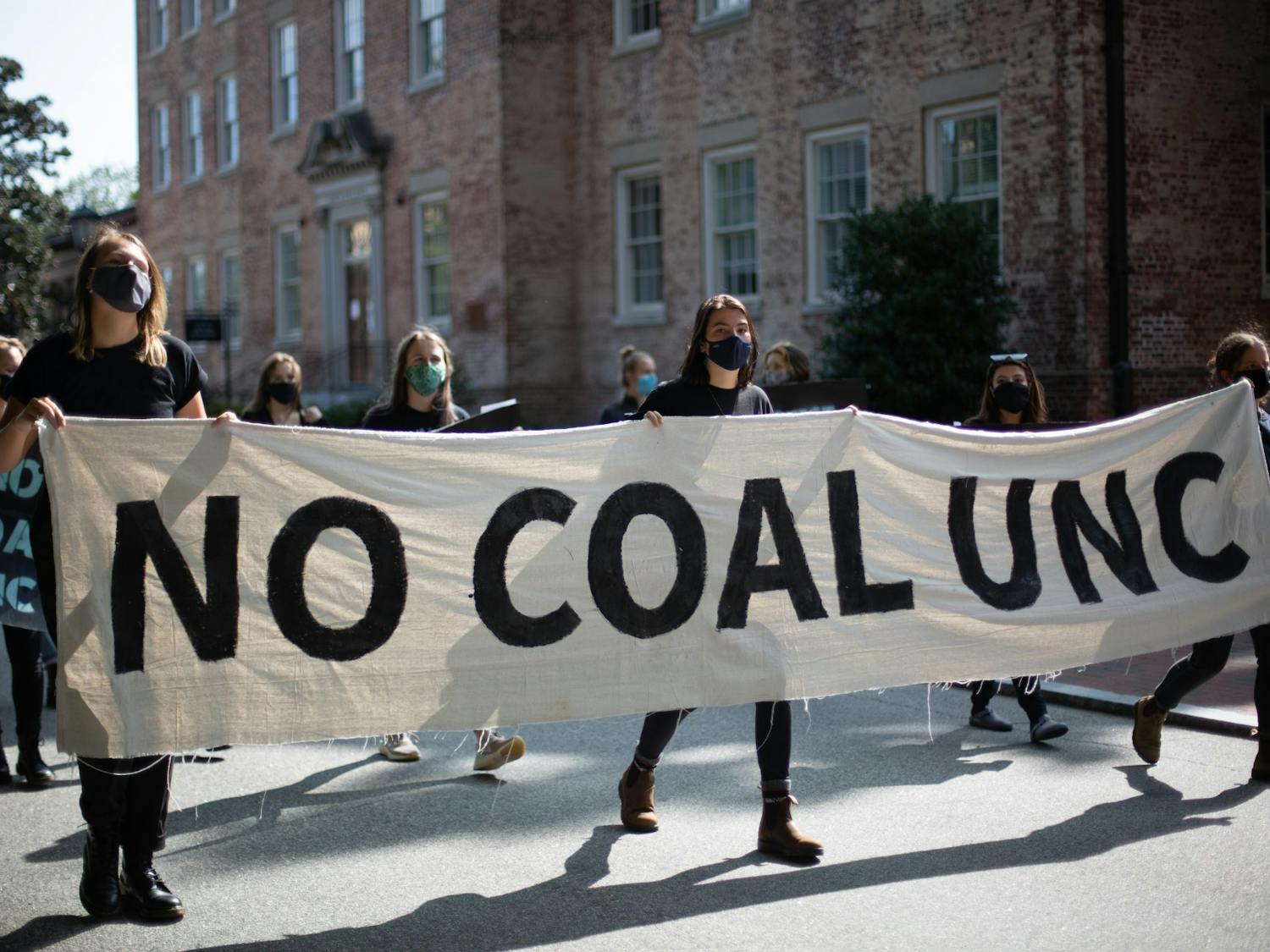 Students march down Cameron Ave. on Tuesday, Sept. 22, 2020 to protest UNC's coal plant.
