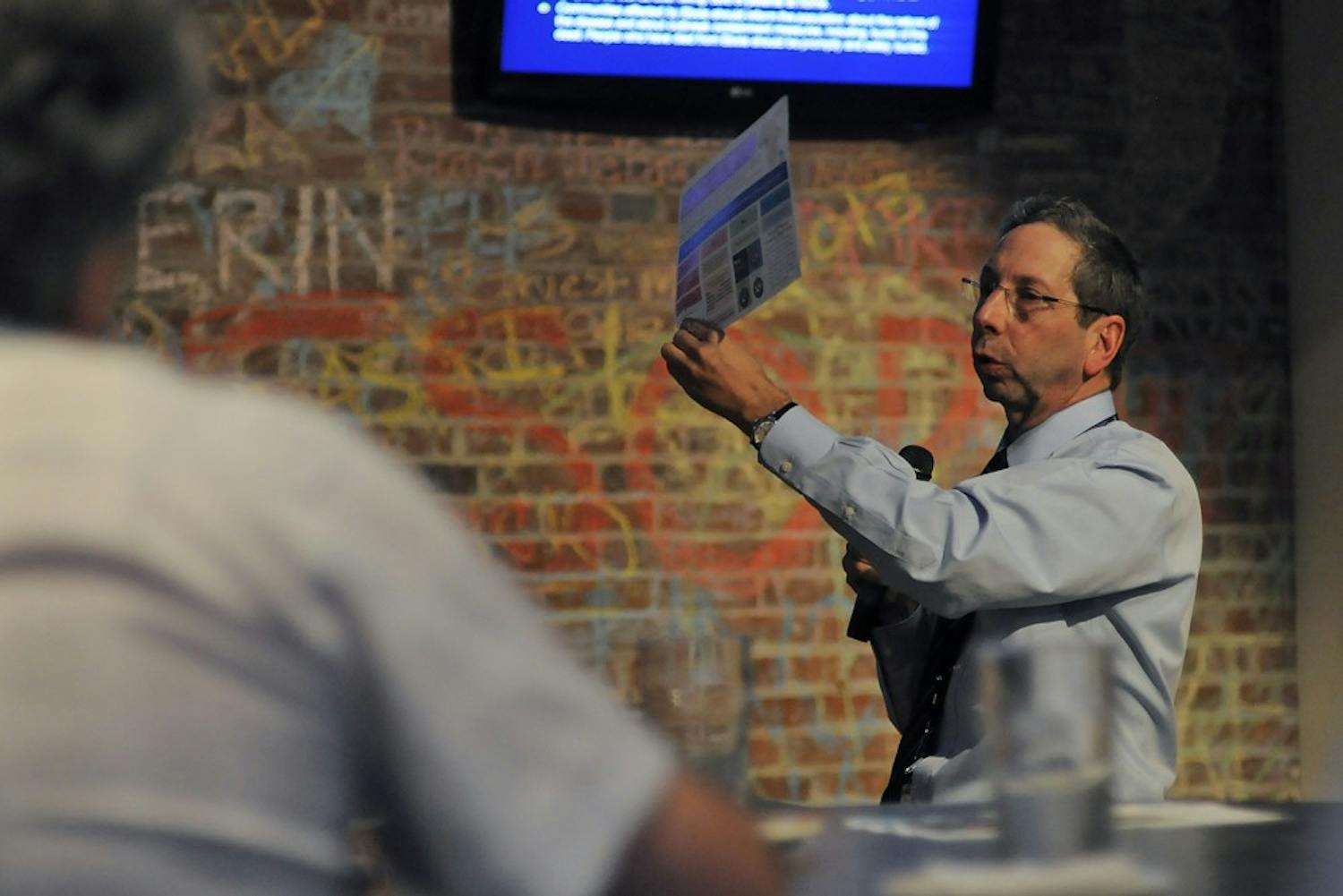 Dr. David Weber speaks at Morehead Planetariums's science awareness program, Carolina Science Cafe, in Top of the Hill's Back Bar.  At monthly educational program for adults, he spoke about the recent outbreak of Ebola in West Africa.