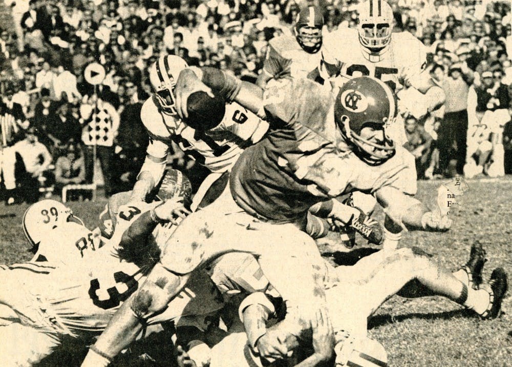 North Carolina fullback Geof Hamlin struggles for yardage against Duke in a 59-34 win in 1970 at Kenan Stadium. He rushed for 862 yards during his three-year career with UNC.