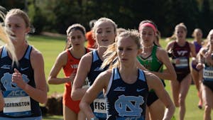 From left: Kelsey Harrington, Emmeline Fisher, and Paige Hofstad compete in the ACC Cross Country Championship on Friday, Oct. 30, 2020. The women's cross country placed 5th in the competition.