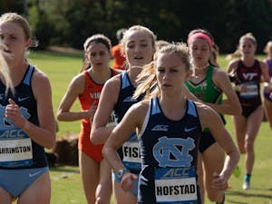 From left: Kelsey Harrington, Emmeline Fisher, and Paige Hofstad compete in the ACC Cross Country Championship on Friday, Oct. 30, 2020. The women's cross country placed 5th in the competition.