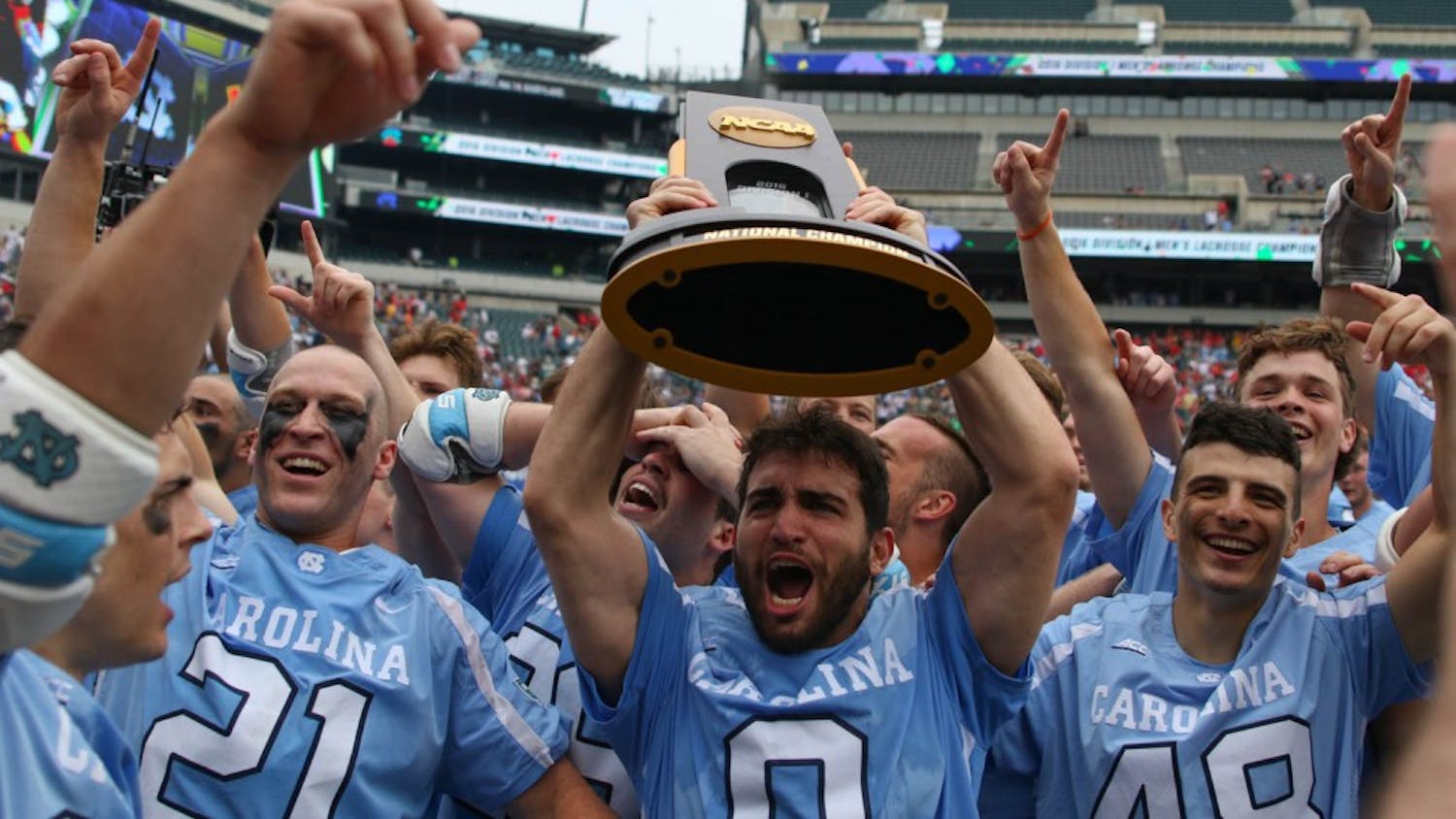UNC attacker Steve Pontrello (0) hoists up the NCAA national championship trophy while his teammates celebrate around him.&nbsp;The unseeded North Carolina men's lacrosse team defeated No. 1 Maryland 14-13 in overtime to claim the program's first national championship since 1991 on Monday at Lincoln Financial Field in Philadelphia.