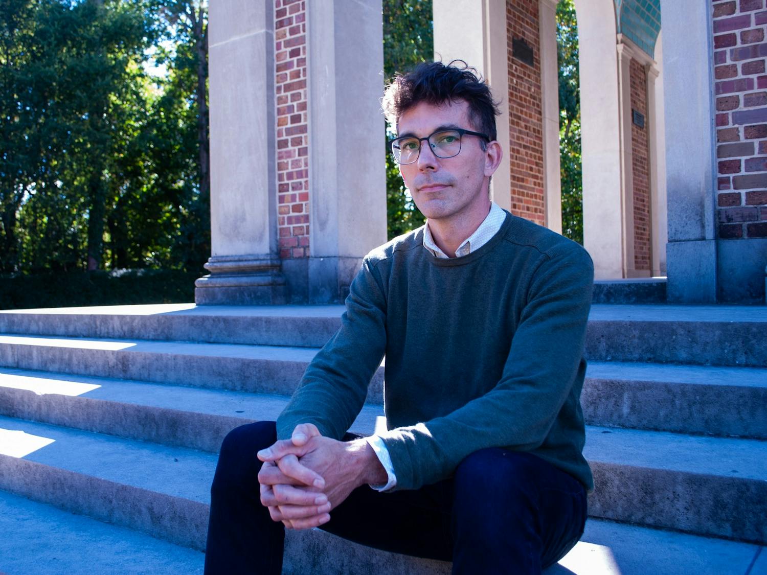 UNC Communications Professor Michael Palm poses for a portrait at the Bell Tower on Oct. 26.