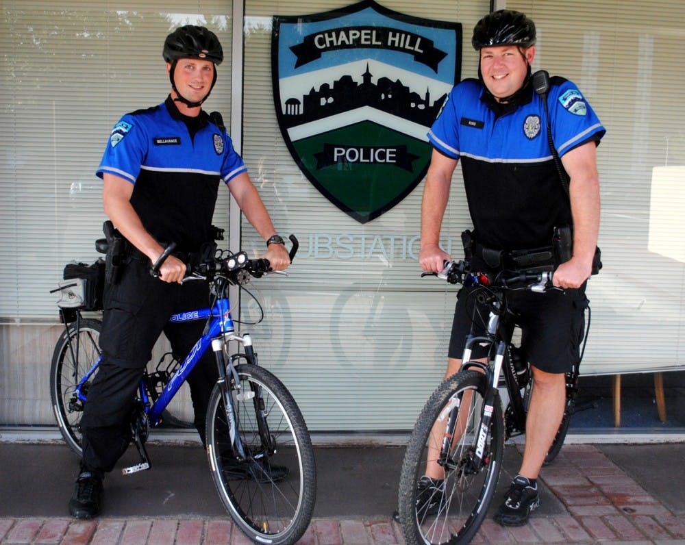 Bicycle officers Jason Bellavance (left) and Chris King are two of nine officers on bicycles that work in the downtown area of Chapel Hill.
