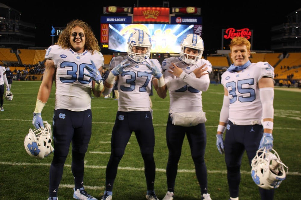 <p>Hunter Crafford (30), Zach Goins (37), Tolson Jeffrey (95), and Chris Ripberger (35) are walk-ons to the UNC football team. Photo courtesy of Zach Goins.</p>