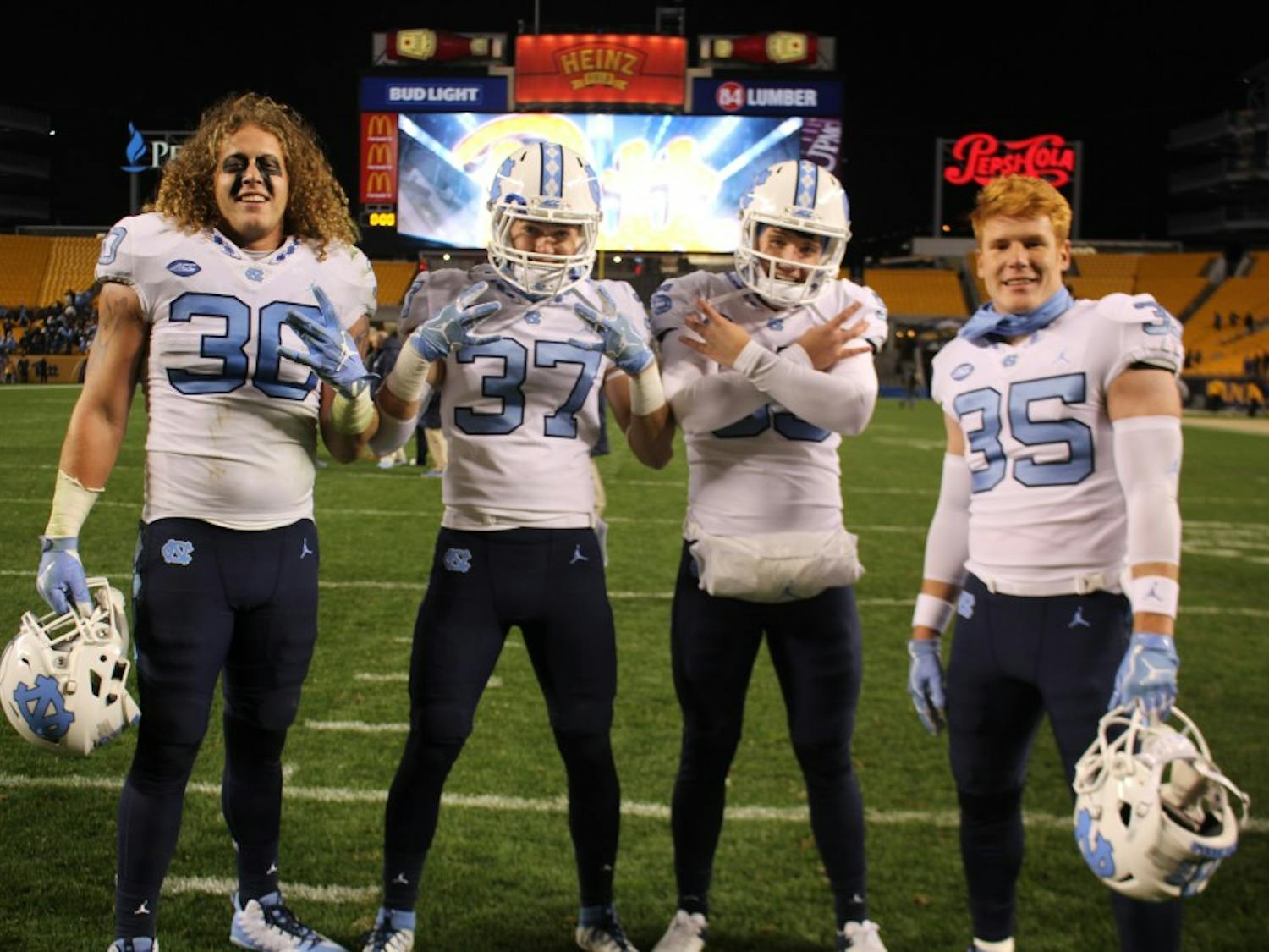 Hunter Crafford (30), Zach Goins (37), Tolson Jeffrey (95), and Chris Ripberger (35) are walk-ons to the UNC football team. Photo courtesy of Zach Goins.