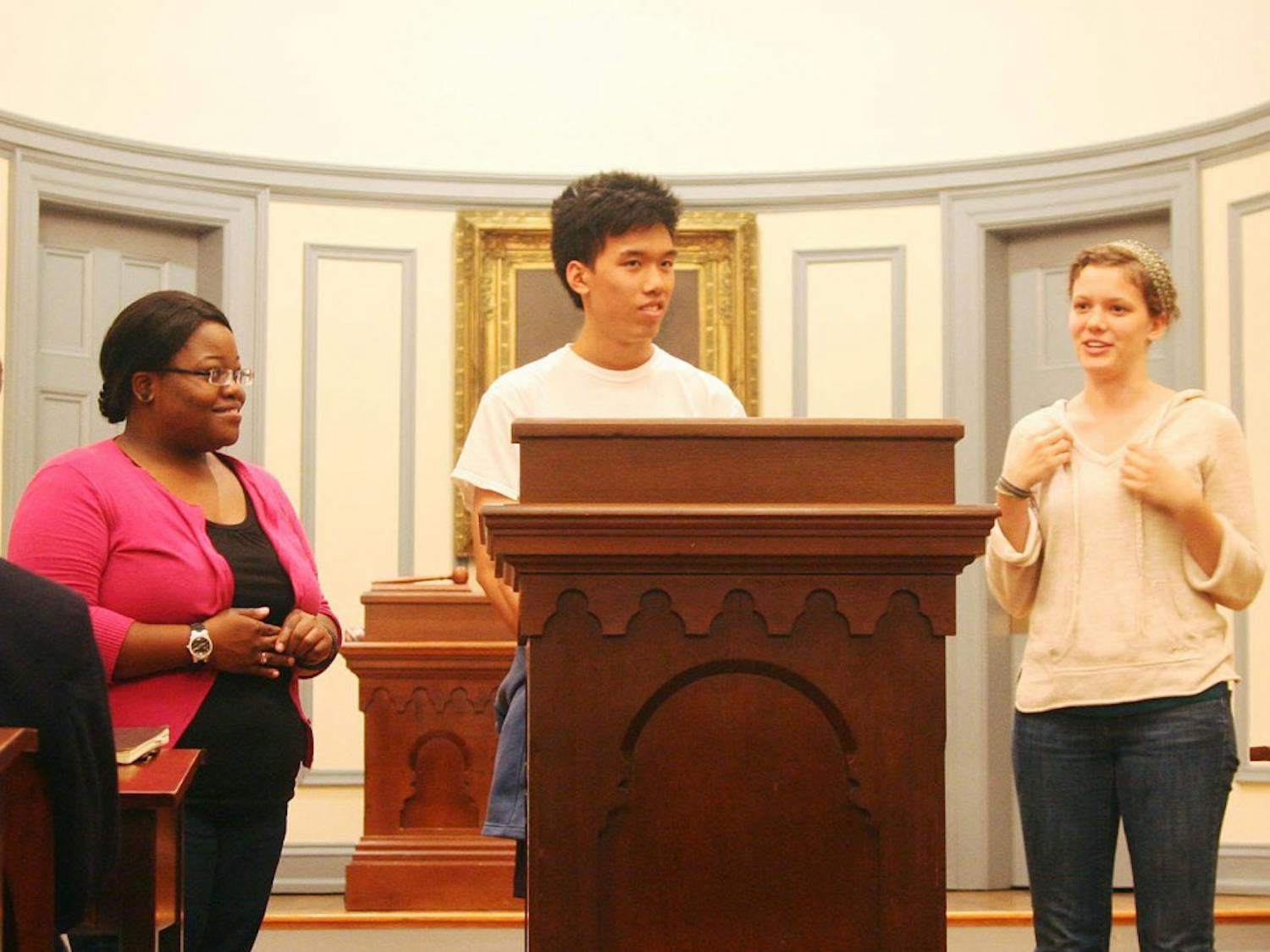 Di-Phi debate on panhandling and homelessness in Chapel Hill. 3 candidates for Chapel Hill town council were present and voiced their viewpoints.Members of  HOPE (Homeless Outreach Poverty Eradication) also were there and explained their work and efforts. Pictured from left to right are: HOPE chairs: Joyelle Gordon (senior sociology major), Kevin Ji (junior public policy and math major), and Alex Biggers (junior public policy/econ major)